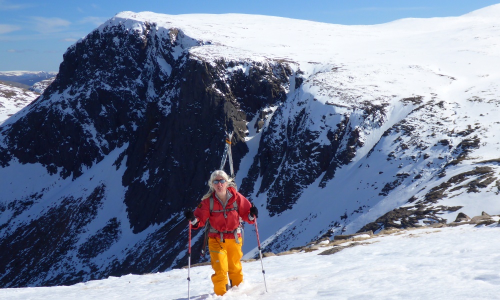 Fiona Chappell in the Cairngorms in winter with a pair of skis.