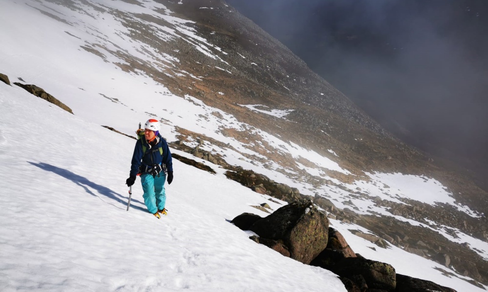 Fiona Chappell with crampons and an ice axe on a snowy slope