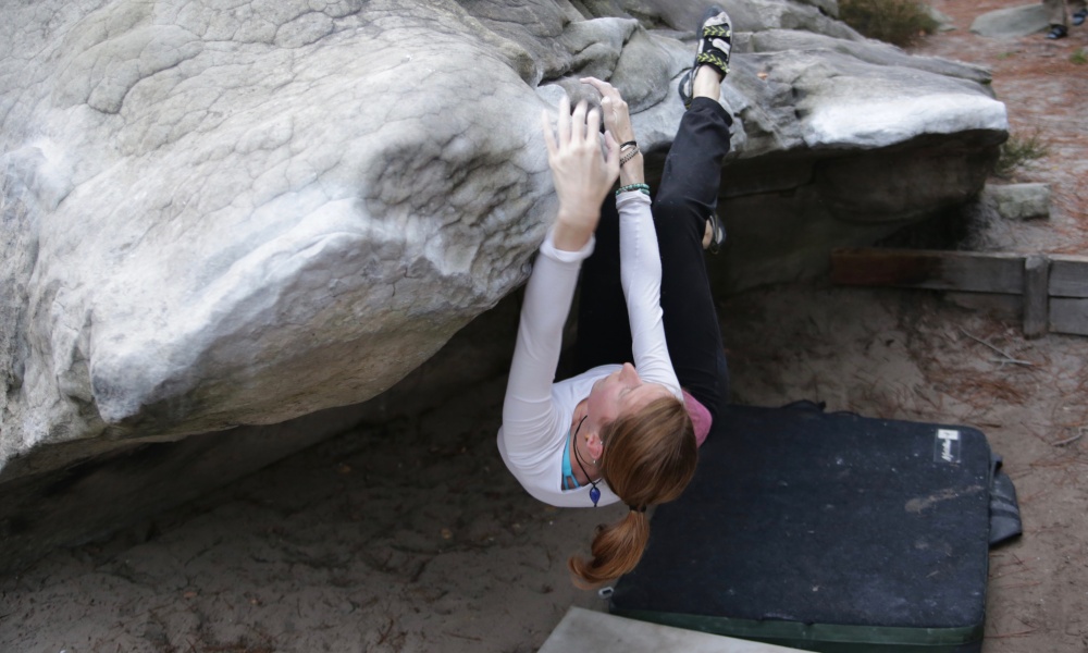 Lisa Farris bouldering in Fontainbleau