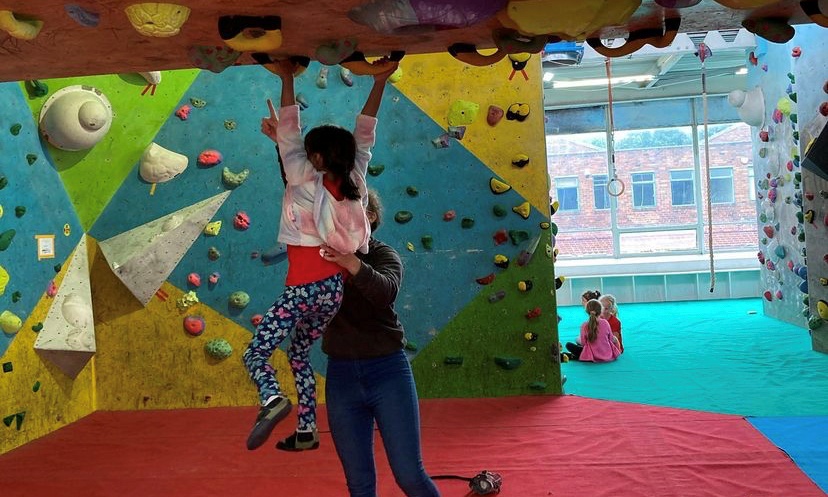 Darcey Haddow instructing bouldering