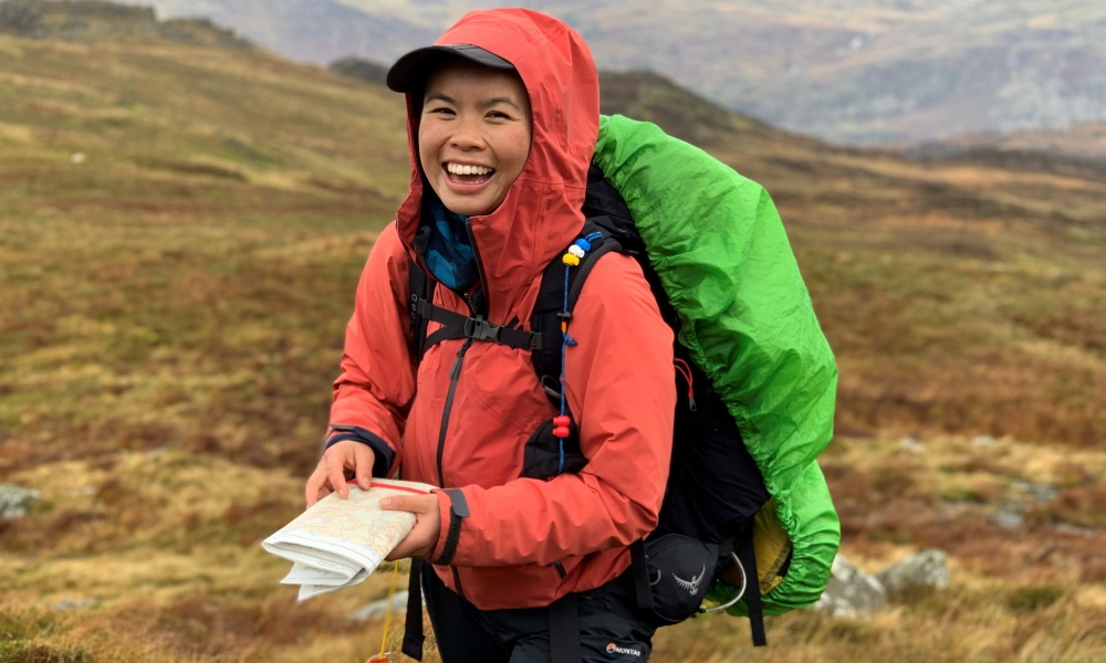 Jessie Leong consulting a map on her Mountain Leader assessment.