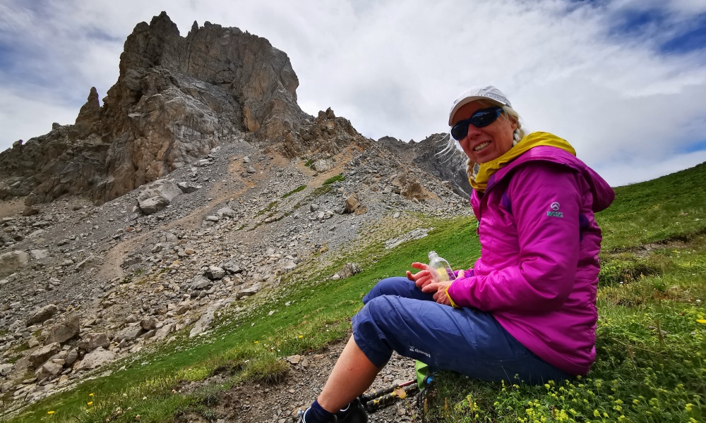 Fiona Chappell sitting in front of an impressive rock formation