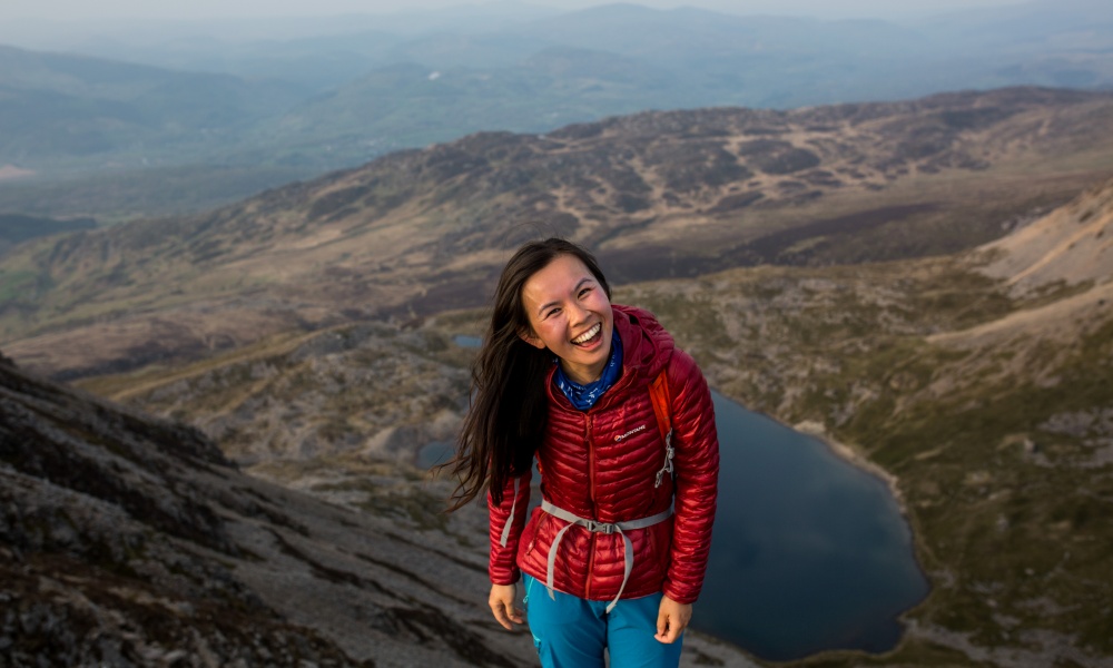 Jessie Leong at sunset on a mountain